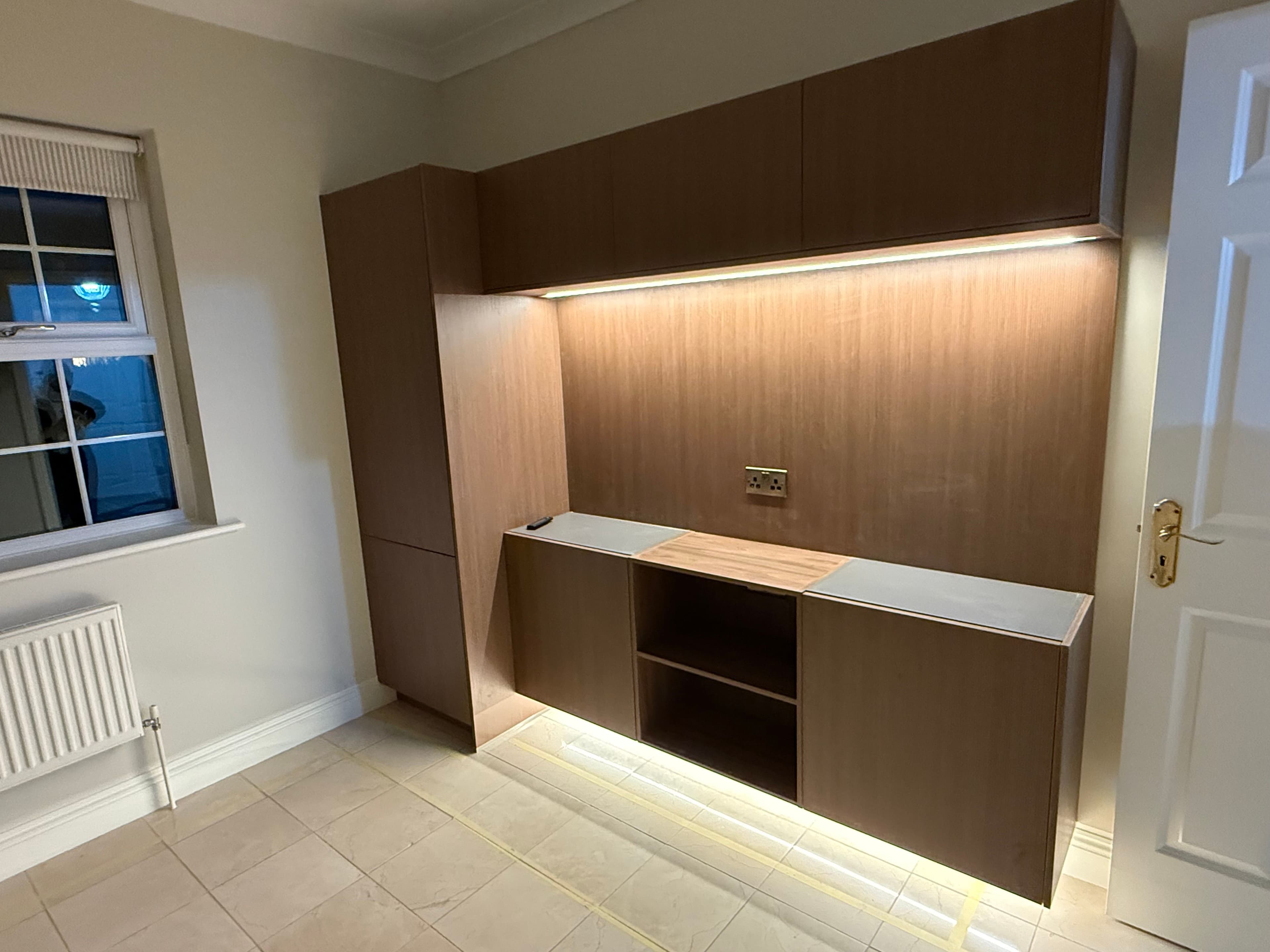Media Wall (Surbiton) - : Custom-built media wall featuring integrated storage, clean lines, and professional cable management.